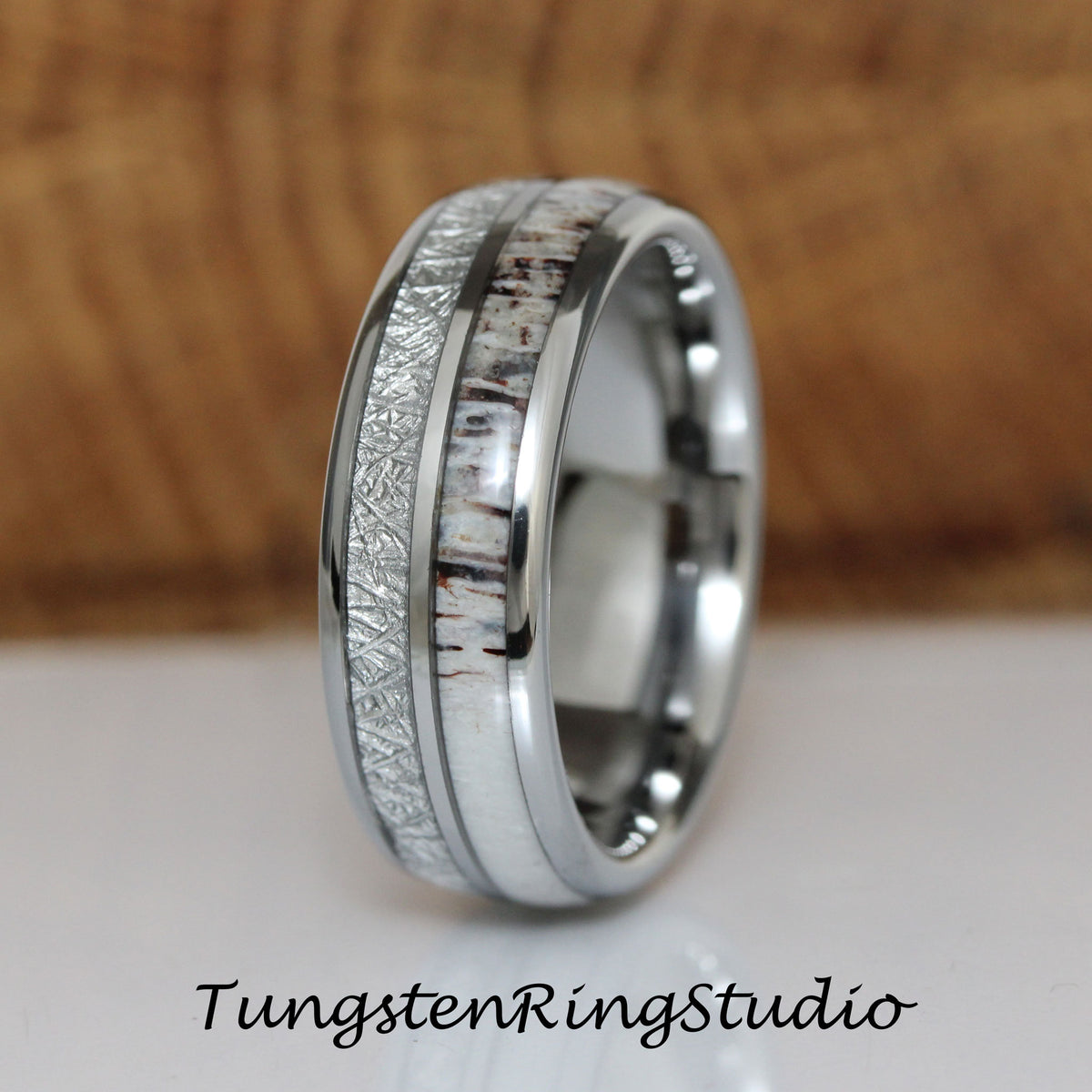 May include: A silver tungsten ring with a white antler inlay and a brushed silver finish.