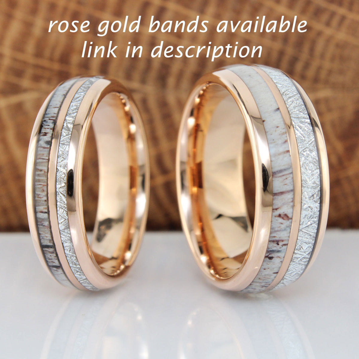 May include: Two rose gold wedding bands with a white and brown inlay. The bands are on a wooden surface.  "rose gold bands available link in description"