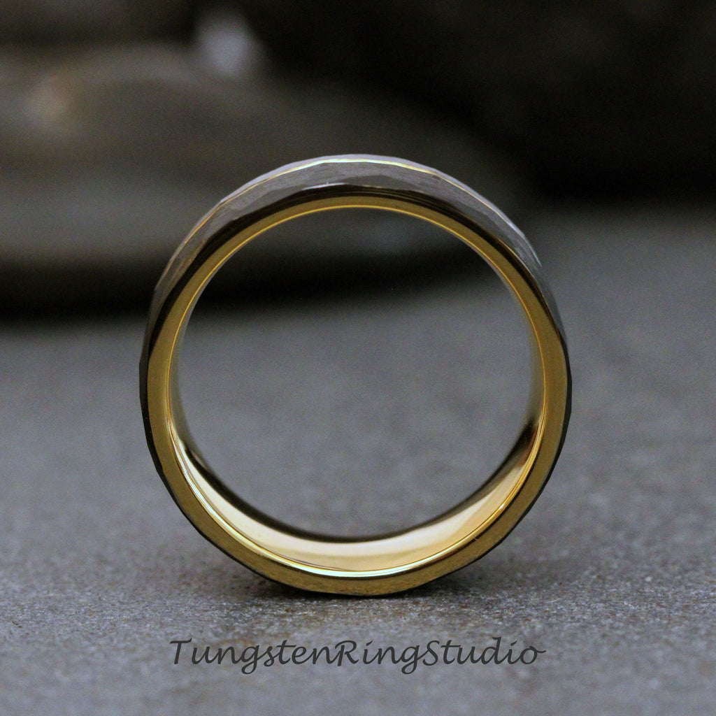 May include: A tungsten carbide ring with a hammered finish and a gold band. The ring is a popular choice for wedding bands.