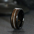 May include: A black tungsten ring with a beveled edge and a copper and white antler inlay. 