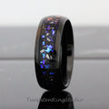 May include: A black tungsten ring with a blue, purple, and orange glitter inlay. The ring is polished and has a beveled edge.