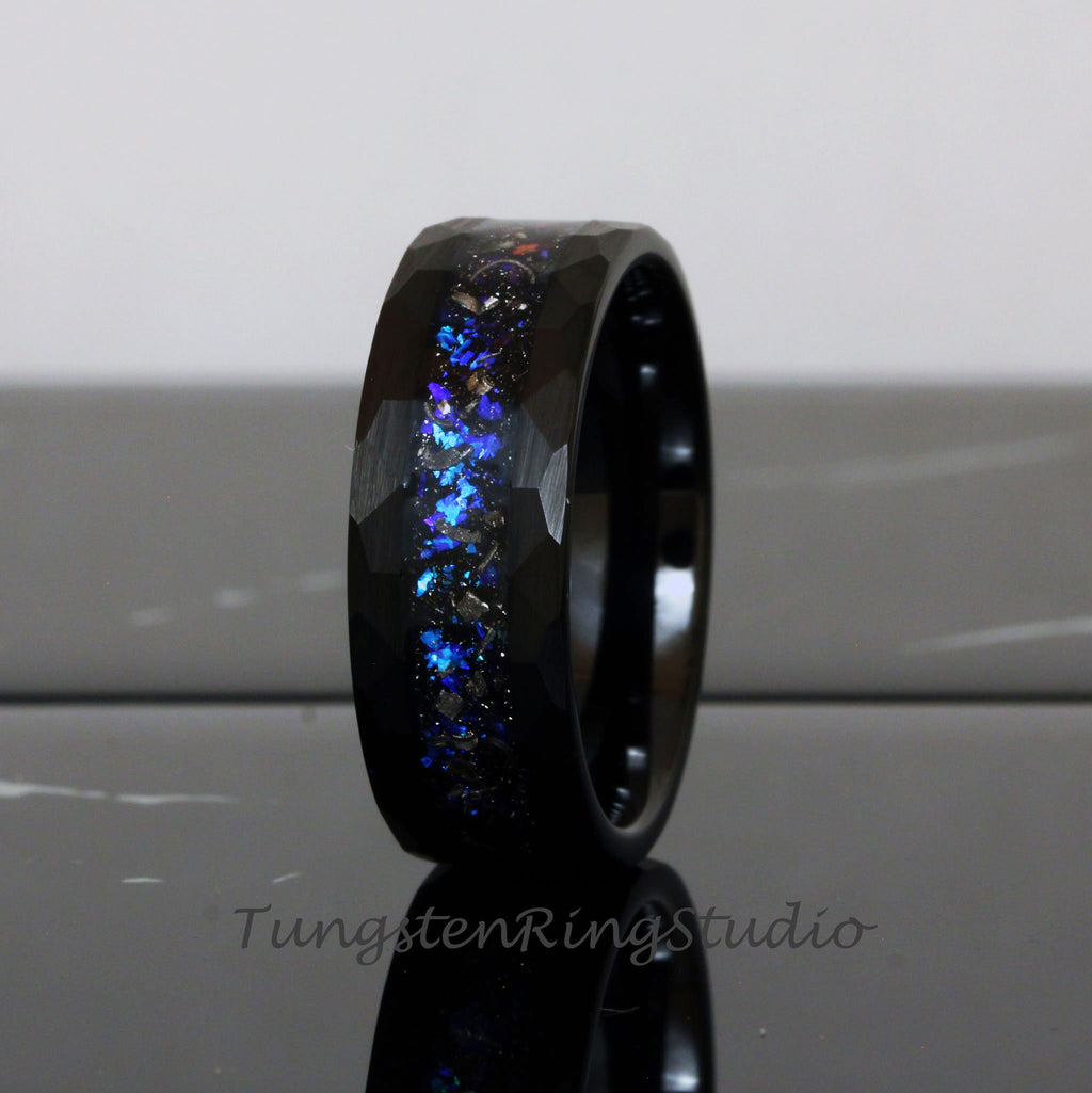 May include: Black tungsten carbide ring with a hammered finish and a blue and silver glitter inlay.