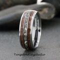 May include: A silver tungsten carbide ring with a brown wood inlay and a row of small clear stones.