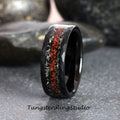 May include: Black tungsten carbide ring with a hammered finish and a red and silver inlay. Tungsten Ring Studio.