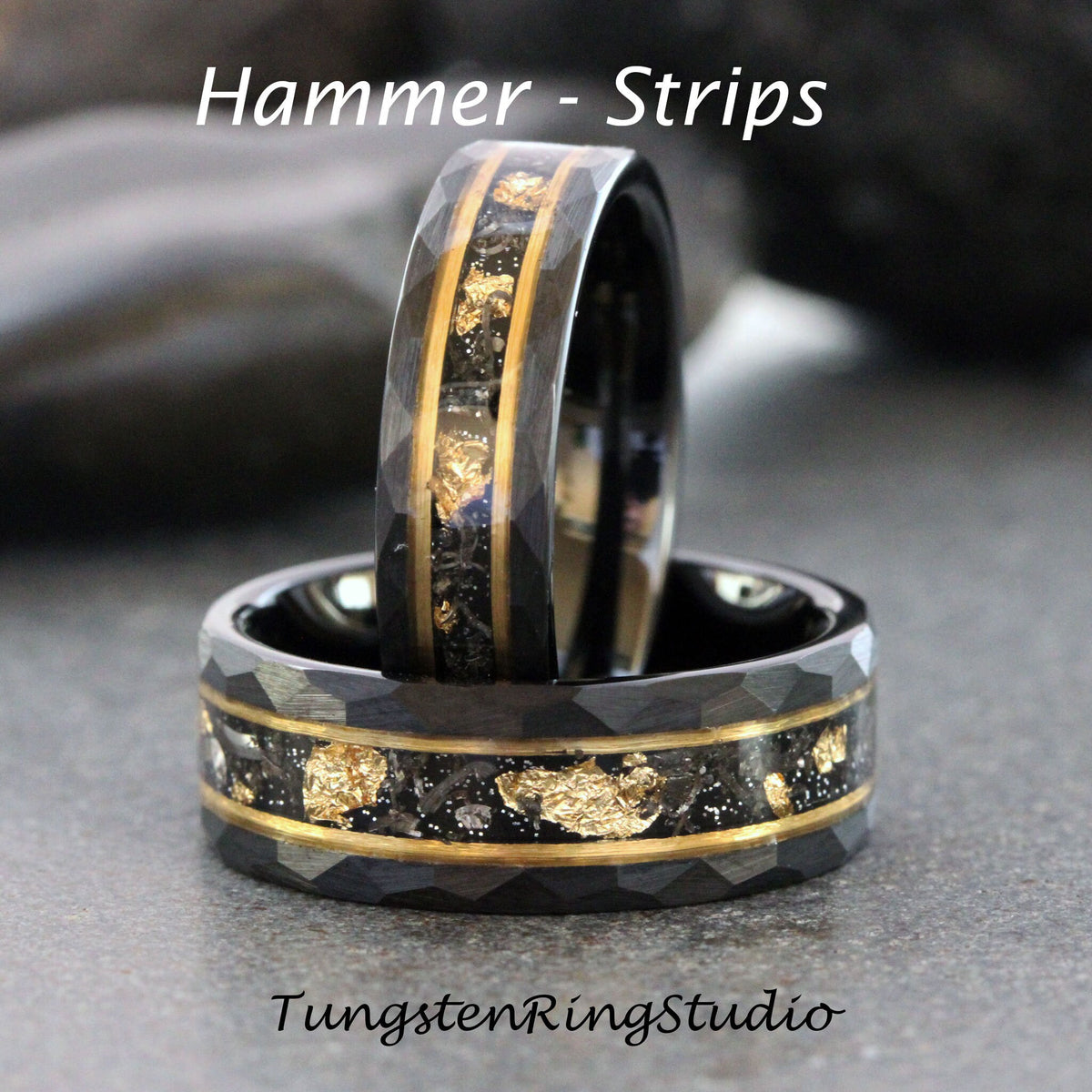 May include: Two black tungsten carbide rings with a hammered finish and gold inlay. The rings have a black carbon fiber inlay and gold flakes. The text "Hammer - Strips" is at the top of the image and "TungstenRingStudio" is at the bottom.