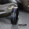 May include: Black tungsten carbide ring with a hammered finish and a blue iridescent inlay.  REDFLAME Jewelry.