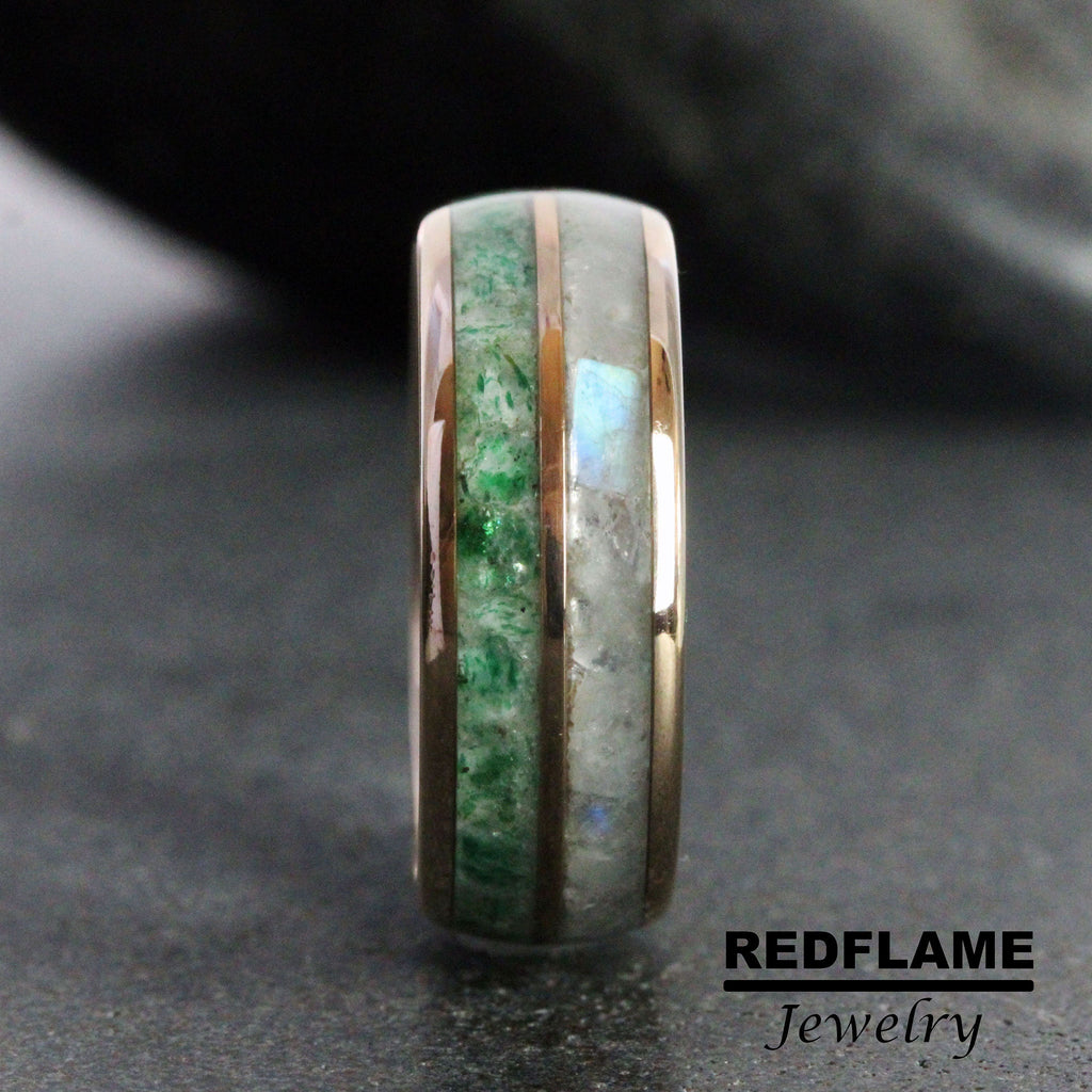 May include: A close-up of a rose gold ring with green and white inlay. The ring is made of metal and has a polished finish.