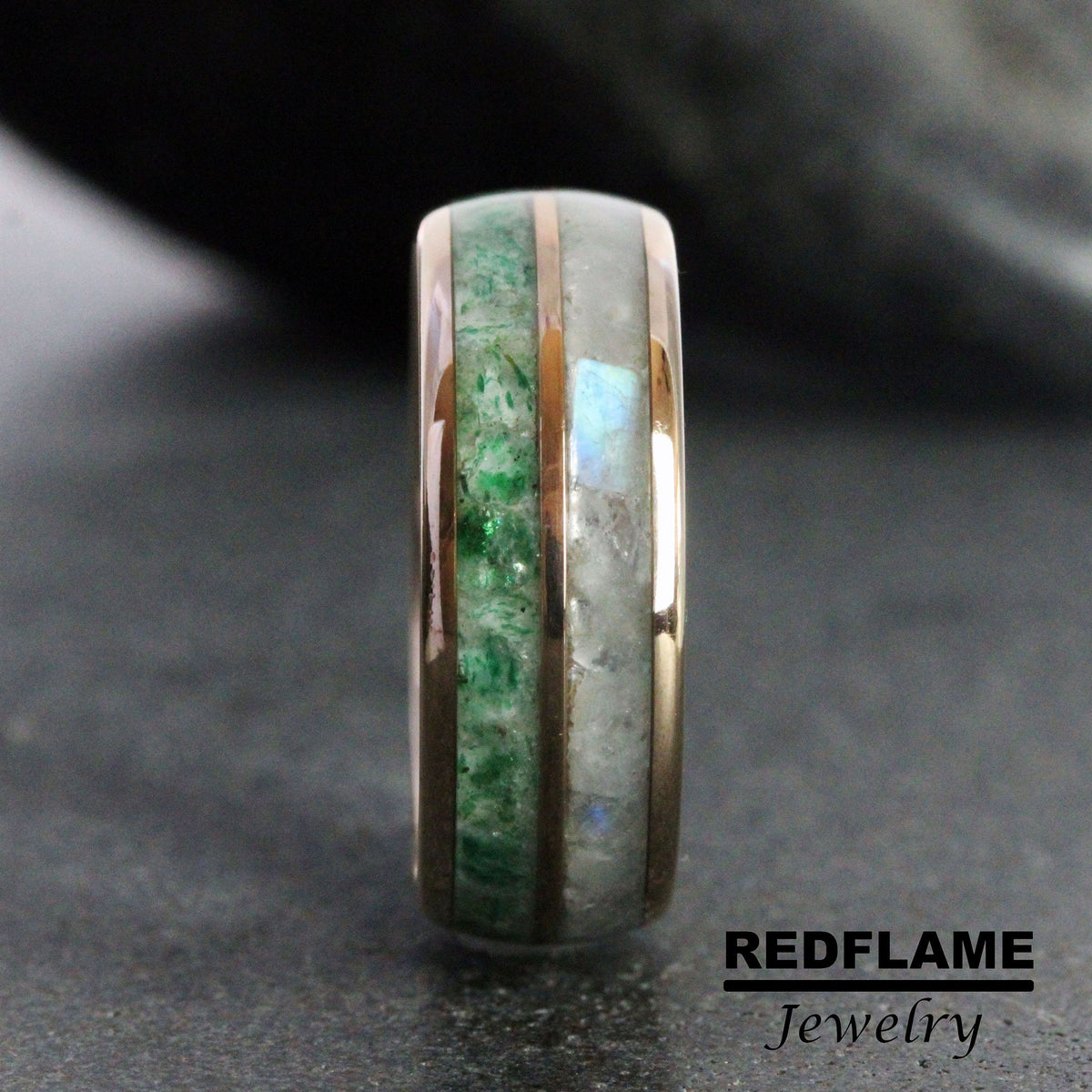 May include: A close-up of a rose gold ring with green and white inlay. The ring is made of metal and has a polished finish.