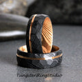 May include: Two black tungsten carbide rings with a gold inlay. The rings are stacked on top of each other.