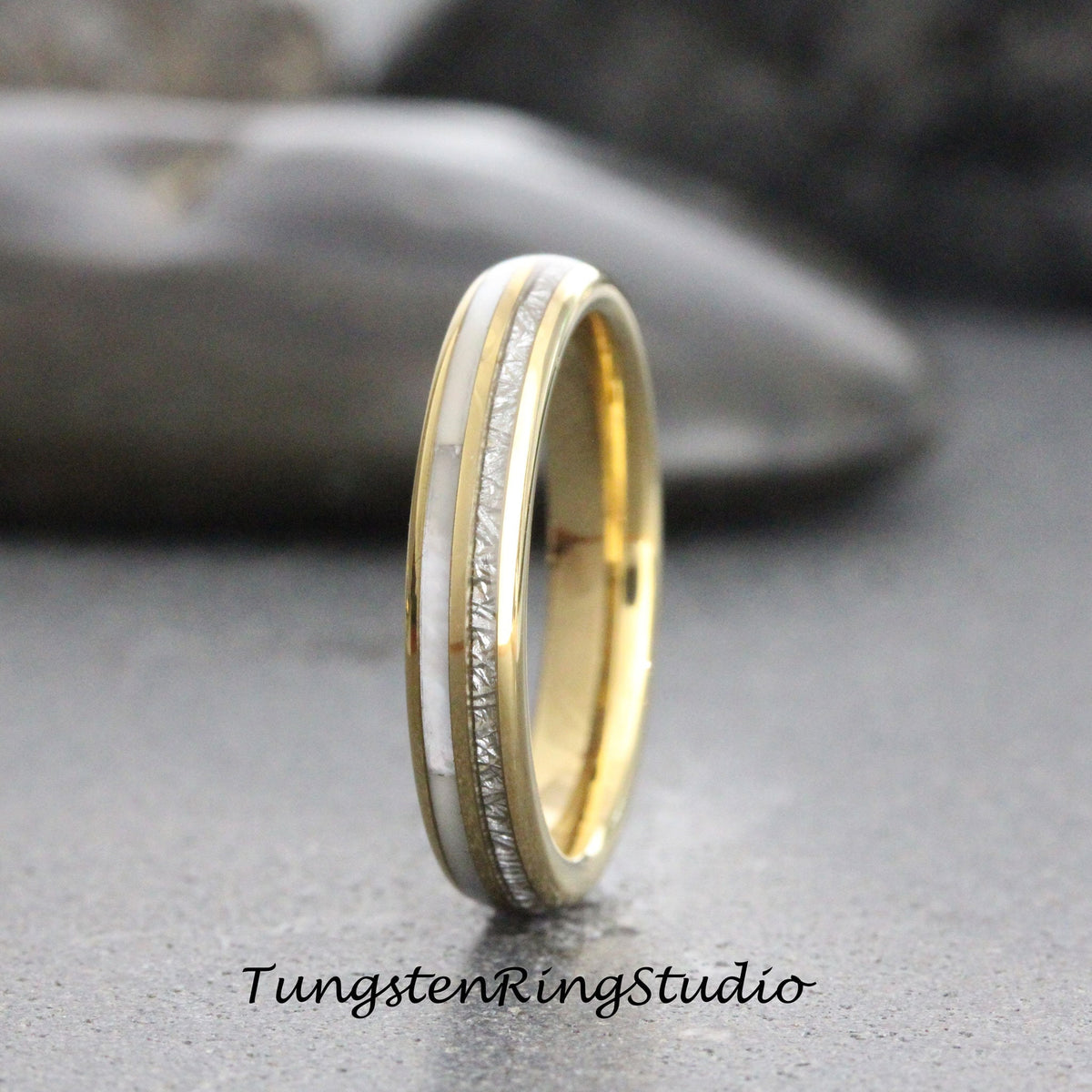 May include: A gold and white tungsten carbide ring with a thin band of white inlay. The ring has a brushed finish.