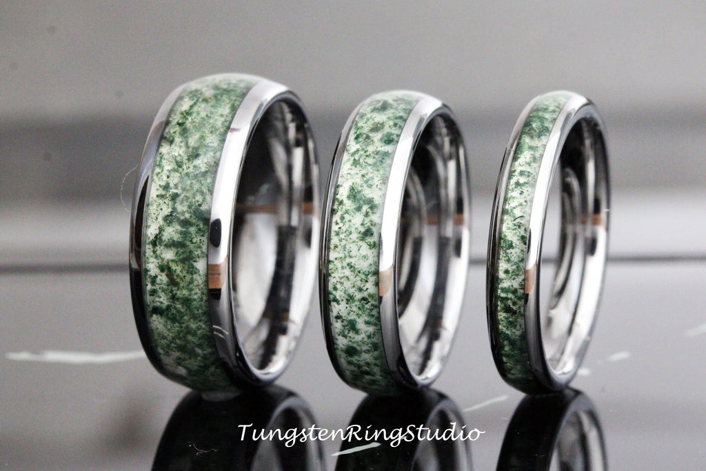 May include: Three tungsten carbide rings with a green and white inlay. The rings are different sizes and are stacked on top of each other.
