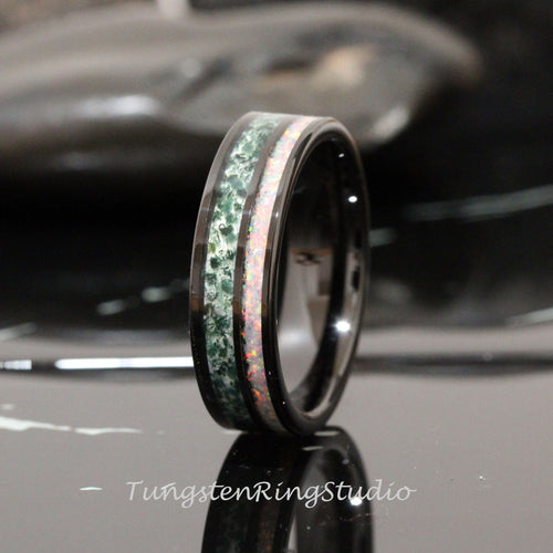 May include: Black tungsten carbide ring with a green and white inlay. The inlay is made of opal and green stone.