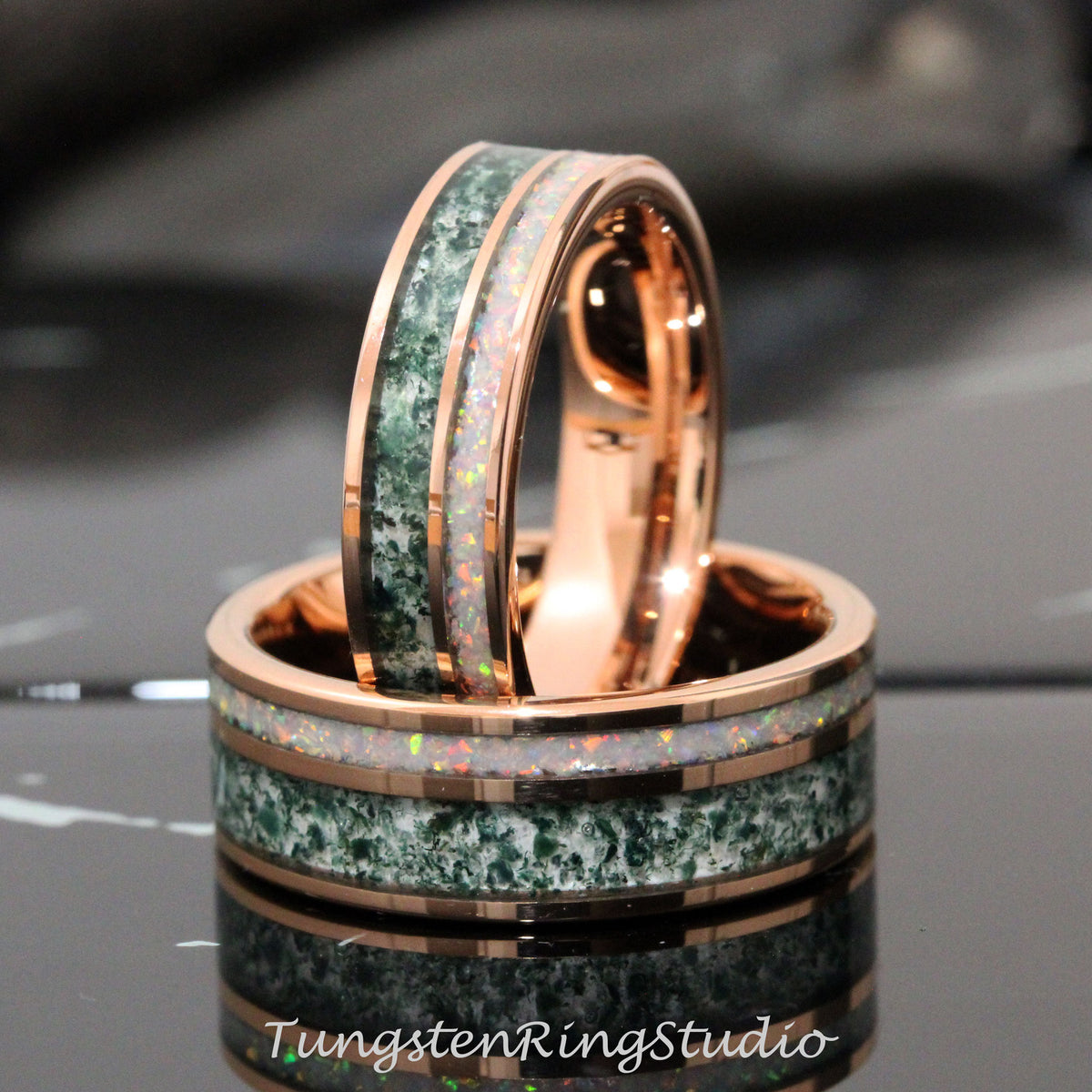 May include: Two rose gold tungsten carbide rings with green and white inlay. The rings are stacked on top of each other.