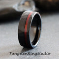 May include: Black tungsten carbide ring with a hammered finish and a red inlay. The ring is approximately 8mm wide.