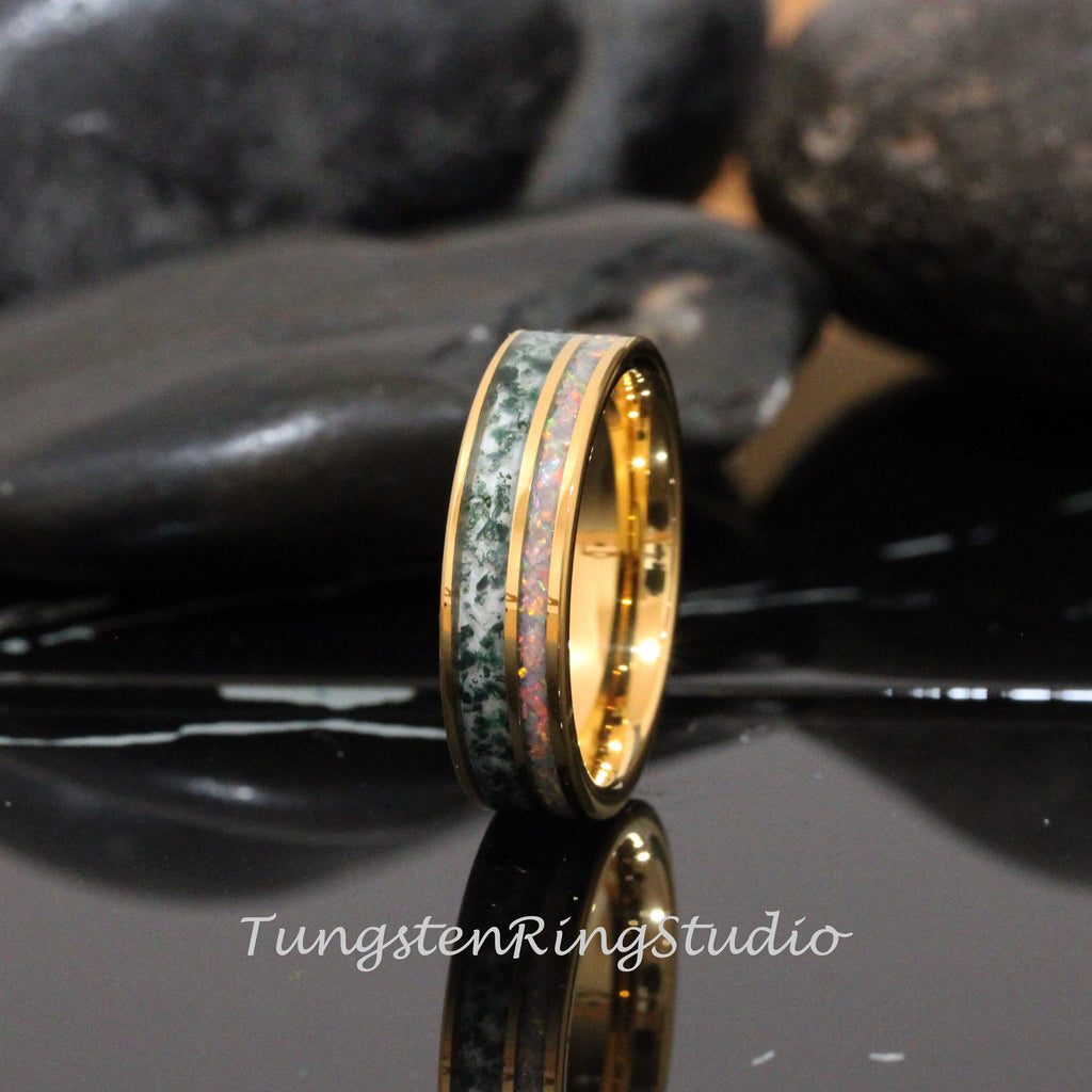May include: A gold tungsten carbide ring with a green and white inlay. The ring has a polished finish and is a popular choice for wedding bands.