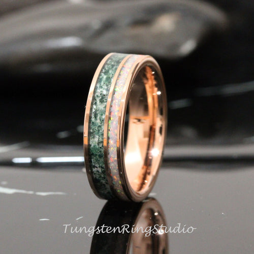 May include: A rose gold tungsten carbide ring with a green and white inlay. The ring has a polished finish and a beveled edge.