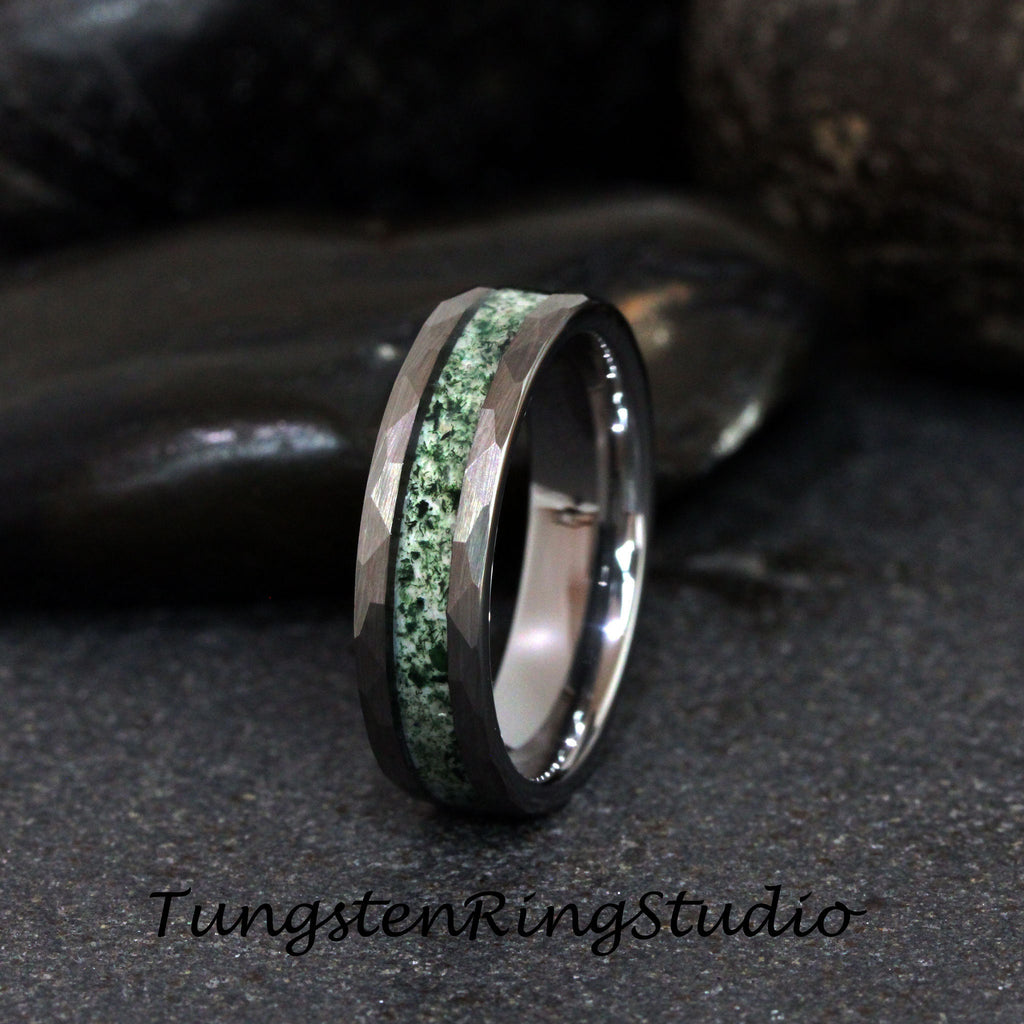 May include: A tungsten carbide ring with a green stone inlay and a hammered finish.
