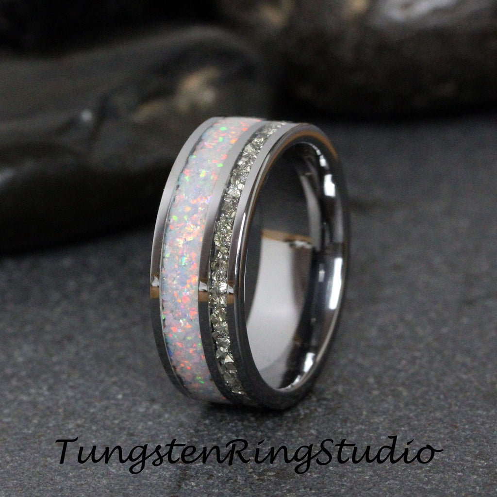 May include: A silver tungsten ring with a white opal inlay and a row of small diamonds.