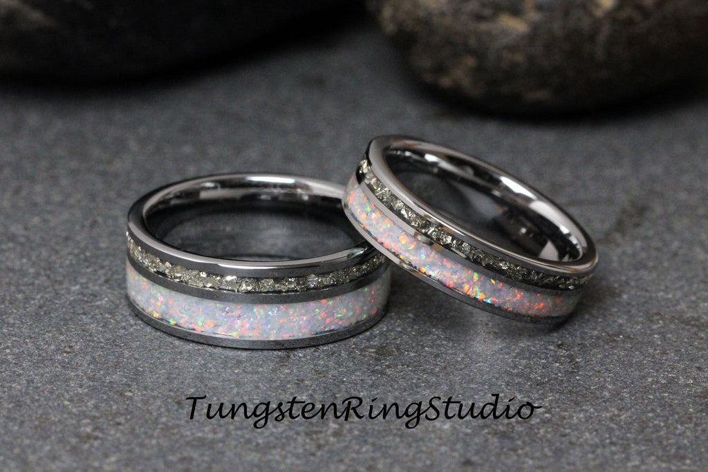 May include: Two silver tungsten carbide rings with a white opal inlay and a row of small diamonds. TungstenRingStudio.