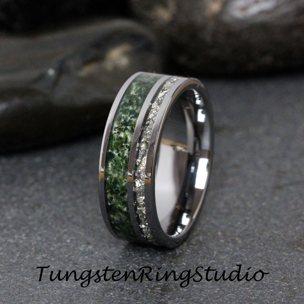 May include: A silver tungsten carbide ring with a green stone inlay and a row of small diamonds.