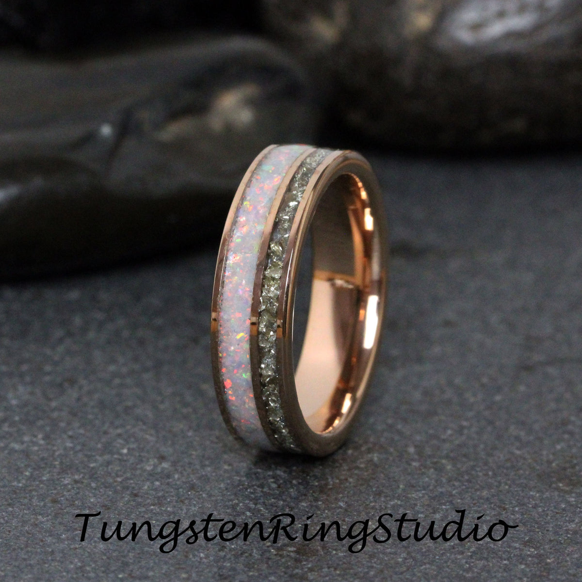 May include: A rose gold tungsten carbide ring with a white opal inlay and a row of small diamonds.