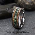 May include: A tungsten carbide ring with a green and brown inlay. The ring has a polished finish and is a popular choice for wedding bands.