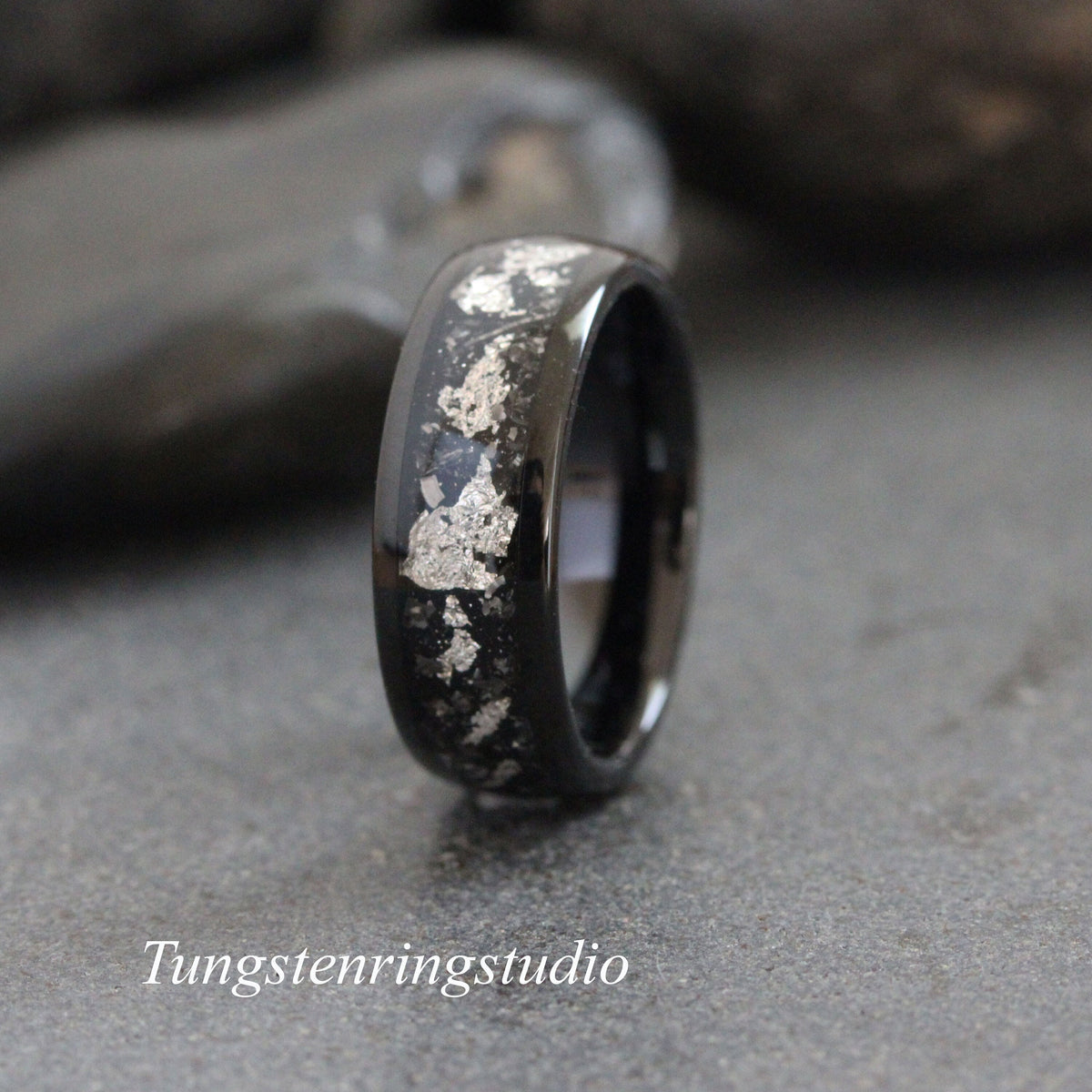 May include: Black tungsten carbide ring with silver flakes embedded in the band.