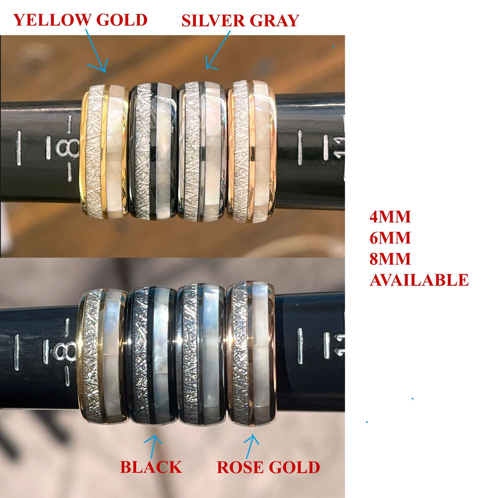 May include: Four different colored men's wedding bands with a white inlay. The bands are yellow gold, silver gray, black, and rose gold. The bands are 4mm, 6mm, and 8mm wide.  The text "4MM 6MM 8MM AVAILABLE" is printed below the bands.
